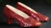 FILE - Sequin-covered ruby slippers worn by Judy Garland in 'The Wizard of Oz' appear at the offices of Profiles in History in Calabasas, Calif. on Nov. 9, 2001.