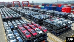 FILE - Chinese BYD electric cars wait to be loaded onto a ship at the international container terminal of Taicang Port at Suzhou Port, in China's eastern Jiangsu province, Sept. 11, 2023. 