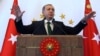 Turkish President Recep Tayyip Erdogan addresses people from southeastern Turkey, in Ankara, Turkey, Tuesday, Oct. 20, 2015.