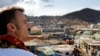 FILE - French President Emmanuel Macron visits the Kavani district in Mamoudzou on the French Indian Ocean territory of Mayotte on Dec. 19, 2024, following Cyclone Chido's passage over the archipelago.
