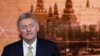FILE - Kremlin spokesman Dmitry Peskov listens during Russian President Vladimir Putin's annual end-of-year news conference in Moscow, Russia, Dec. 19, 2019. 