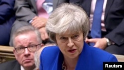 British Prime Minister Theresa May speaks after winning a confidence vote, after Parliament rejected her Brexit deal, in London, Jan. 16, 2019, in this screen grab taken from video. 