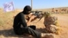 A rebel fighter from the "First Battalion" under the Free Syrian Army takes part in a military training on June 10, 2015, in the rebel-held countryside of the northern city of Aleppo. 