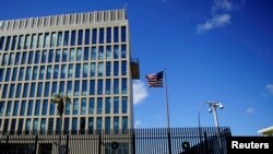 FILE - A security guard stands outside the U.S. Embassy in Havana, Cuba, Dec. 12, 2017.