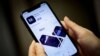 FILE PHOTO- A woman looks at Marcus, a savings and loans app by Goldman Sachs, in New York, U.S., on January 10, 2020. REUTERS/Mike Sega