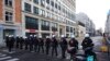 Police officers form a line as they prepare to confront protestors during a demonstration regarding COVID-19 restrictions in Brussels, Feb. 14, 2022.
