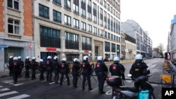 Police officers form a line as they prepare to confront protestors during a demonstration regarding COVID-19 restrictions in Brussels, Feb. 14, 2022.