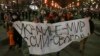 Demonstrators march with a banner that reads: 'Ukraine - Peace, Russia - Freedom' in Moscow, Feb. 24, 2022, after Russia's attack on Ukraine. 