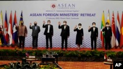 oreign ministers of the Association of Southeast Asian Nations (ASEAN) pose for a photo during a photo session in Phnom Penh, Cambodia.
