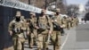 National Guard soldiers walk near the Capitol, March 4, 2021, on Capitol Hill in Washington.
