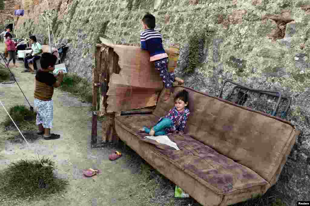 Children play in a municipality-run camp that houses migrants and refugees, in the city of Chios, on the Greek Aegean island of Chios.