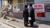 FILE - People gather outside the fire damaged Adass Israel Synagogue in Melbourne, Monday, Dec. 9, 2024. 