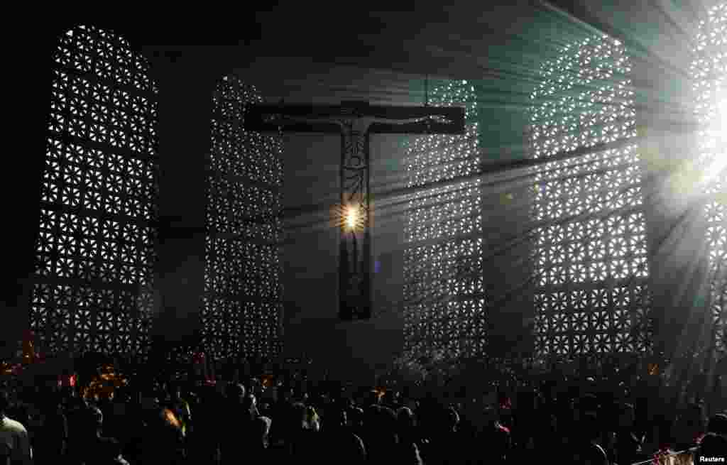 Pilgrims pray at the Basilica of Our Lady of Aparecida, Brazil's national saint, in the city of Aparecida, Sao Paulo state, Brazil.