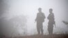 FILE - Fighters opposing Myanmar's military are seen in Kaw Thoo Lei, Kayin state, Myanmar, Jan. 31, 2019. Myanmar's army battled local militia fighters Saturday in the northwestern town of Mindat.