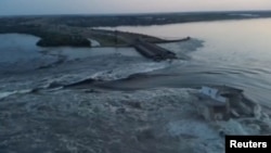 A general view of the Nova Kakhovka dam that was breached in Kherson region, Ukraine June 6, 2023 in this screen grab taken from a video obtained by Reuters