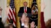 FILE - President Donald Trump looks at reporters during a news conference in the East Room of the White House in Washington, Feb. 16, 2017. 
