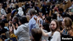 People applaud as they listen to Chandni Raina during a closing plenary meeting, at the COP29 United Nations Climate Change Conference, in Baku, Azerbaijan Nov. 24, 2024. 