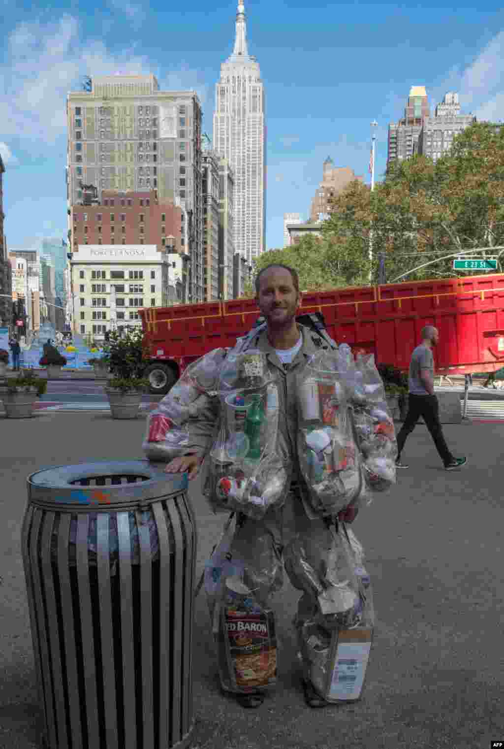 Rob Greenfield, an environmental activist who is spending a month in New York, has hanging on himself all the trash he's produced in ziplog bags, Oct. 4, 2016.