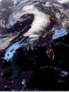 Citra satelit dari Badan Kelautan dan Atmosfer Nasional yang diambil pada tanggal 15 Maret 2025 ini menunjukkan cuaca ekstrem yang mengancam wilayah selatan AS.