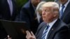 President Donald Trump prepares to sign the Executive Order on Promoting Free Speech and Religious Liberty during a National Day of Prayer event at the Rose Garden of the White House in Washington, May 4, 2017.