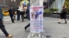A reward poster hangs on a light pole outside the New York Hilton Midtown Hotel in New York on Dec. 5, 2024, where Brian Thompson, the CEO of UnitedHealthcare, was fatally shot on Wednesday.