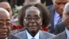 FILE: Zimbabwean president, Robert Mugabe, center, arrives in Pretoria, South Africa Tuesday, April 7, 2015 for a state visit to the country.(AP Photo
