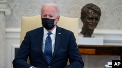 President Joe Biden speaks during a meeting with members of the Congressional Hispanic Caucus, in the Oval Office of the White House, Tuesday, April 20, 2021, in Washington. Biden said Tuesday that he is "praying the verdict is the right verdict" in…