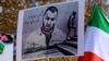 FILE - People hold placards bearing portraits of Iranian rapper Toomaj Salehi, who is arrested in Iran during a rally in support of Iranian women in Istanbul, on November 26, 2024.