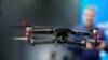 FILE - A Chinese-made DJI Mavic 2 Zoom flies in a netted area during the 2019 CES in Las Vegas, Nevada, Jan. 9, 2019.
