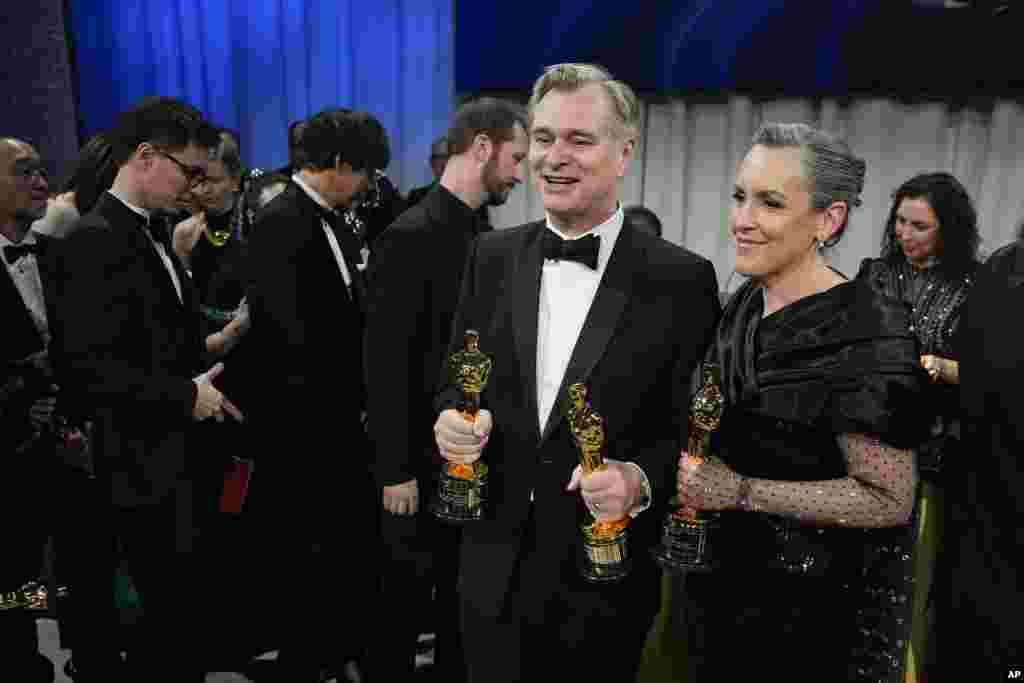 Christopher Nolan, winner of the awards for best director and best picture for "Oppenheimer," left, and Emma Thomas, winner of the award for best picture for "Oppenheimer" pose at the Governors Ball after the Oscars on March 10, 2024, at the Dolby Theatre in Los Angeles.