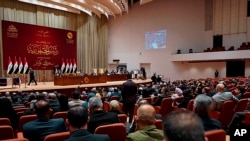 FILE - This photo from Iraqi parliament shows Iraqi lawmakers attending a parliamentary session in Baghdad, Iraq, Oct.13, 2022. (Iraqi Parliament Media Office via AP)