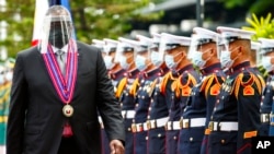 United States Defense Secretary Lloyd Austin views the military honor guard at Camp Aguinaldo military camp in Quezon City, Metro Manila, Philippines.