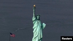 Mutum-mutumin da ake kira Statue of Liberty a Amurka, wanda wuri ne da Amurka take tunkaho da shi. 