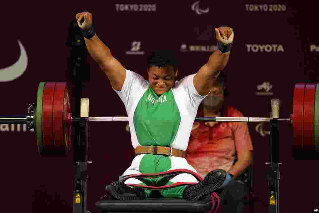 Nigeria's Folashade Oluwafemiato celebrates after winning a gold medal in women's -86kg powerlifting final at the Tokyo 2020 Paralympic Games, in Tokyo, Japan. (AP Photo/Kiichiro Sato)