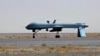 FILE - U.S. Predator unmanned drone armed with a missile stands on the tarmac of Kandahar military airport in Afghanistan. 