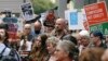 FILE - Protestors against asylum seekers being deported, gather for a rally in Sydney, Australia, Thursday, Feb. 4, 2016. 