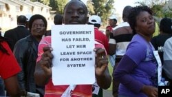Activists demonstrate in the streets of Mbabane on July 21, 2011 to draw attention to their government's dwindling supply of anti-retroviral drugs, as Swaziland is the world's highest HIV infection rate.
