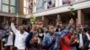 FILE - Youth attending a special dedication service at the Holy Family Basilica hold roses in honor of lives lost during recent protests against government-proposed tax hikes, in Nairobi, Kenya, July 7, 2024. 