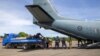 A supplied image of Australian Defence Force and Papua New Guinea Police Force personnel unloading ballot papers for the upcoming National Election, which runs from June 24 until July 8, from a C-27J Spartan aircraft in Papua New Guinea, June 15, 2017.