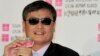 Chinese activist Chen Guangcheng listens to a reporter's question during a press conference at the Taiwan Association for China Human Rights building in Taipei, Taiwan, June 24, 2013. 