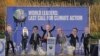 A replica of the COP26 summit's main UN negotiation stage, carrying activists dressed as world leaders, is half-sunk in the Clyde Canal during the COP26 summit in Glasgow, Scotland Tuesday Nov. 9, 2021.