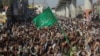 Para pendukung dari kelompok militan Islam Tehrik-e-Labaik Pakistan (TLP) berunjuk rasa di Lahore, Pakistan, pada 22 Oktober 2021. (Foto: Reuters/Mohsin Raza)