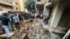 People check the damage at the scene of an Israeli strike in Beirut's southern suburbs on Sept. 20, 2024. 