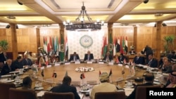 FILE - Permanent representatives of the Arab League take part in an emergency meeting at the League's headquarters in Cairo, Egypt, Dec. 31, 2019.