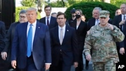 FILE - In this June 1, 2020 file photo, President Donald Trump departs the White House to visit outside St. John's Church, in Washington.