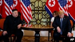 FILE - President Donald Trump meets North Korean leader Kim Jong Un in Hanoi., Feb. 28, 2019. 