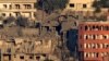 Houses lie in ruin in Khiam, a town near the Lebanese-Israeli border that was hit by Israeli air strikes on June 21, 2024, as seen from the Lebanese town of Marjayoun on June 22. 