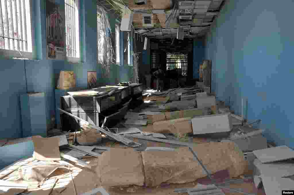Damaged artifacts inside the museum of the historic city of Palmyra, after forces loyal to Syria's President Bashar al-Assad recaptured it, in this handout picture provided by SANA on March 27, 2016.