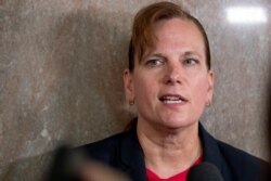 Former aide, Army Col. Kathryn Spletstoser, who has accused that Air Force Gen. John Hyten subjected her to a series of unwanted sexual advances, speaks to members of the media following Hyten's confirmation hearing, July 30, 2019.