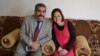 FILE - Sarah Said Haydar, 16, with her father before her capture by Islamic State militants last August. 